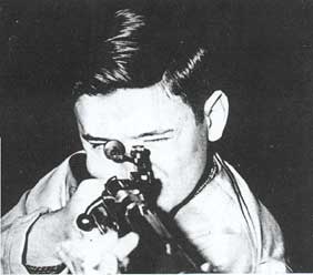 Rifle Team Captain Charles Palmer, four year veteran of the Rifle Team, prepares to fire during important match