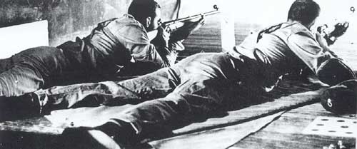 1962 Tech Rifle Team shooting in the prone position