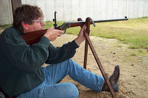 Shooting a Winchester 1885 Highwall Rifle off cross-sticks at 300 yards.