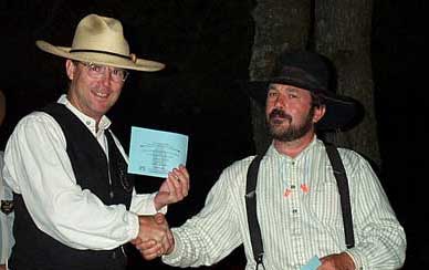 Accepting his award for winning the Single Shot Long Range Rifle Match at the 2003 SASS Maine State Championships.