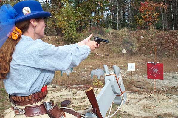 Angel Mountain shooting pistol from horseback.