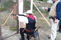 Deadhead shooting shotgun from the chair.