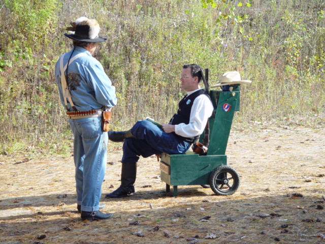 Taking a break on the guncart, observing the scenario and talking with George Silver at Pelham, NH in October.